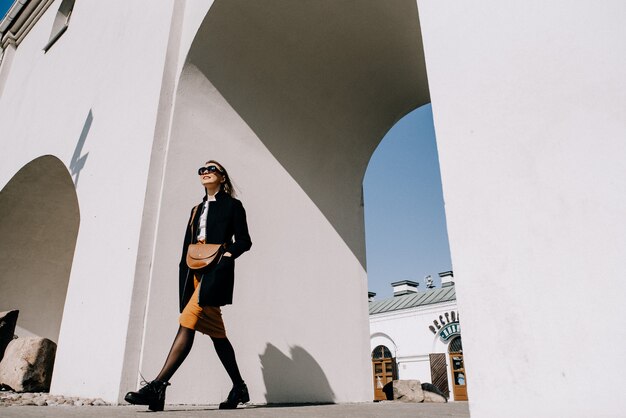 Young beautiful woman walking in street