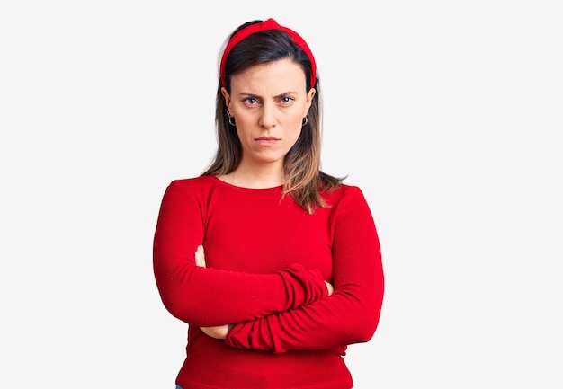 Young beautiful woman wearing casual clothes skeptic and nervous disapproving expression on face with crossed arms negative person