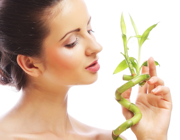 Young beautiful woman with bamboo