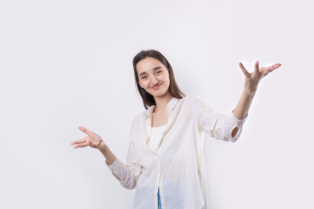 Young beautiful woman with facial expression of surprise standing over white background