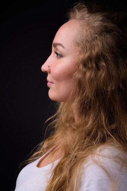 young beautiful woman with long wavy blond hair