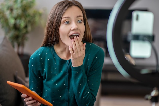 Young beautiful woman with a tablet in hands