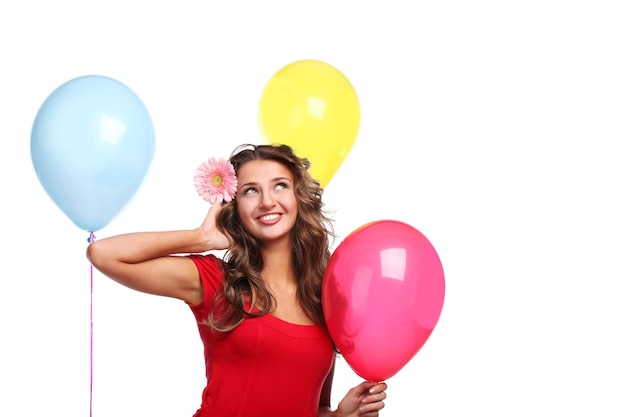 Young beautiful woman with three color balloons