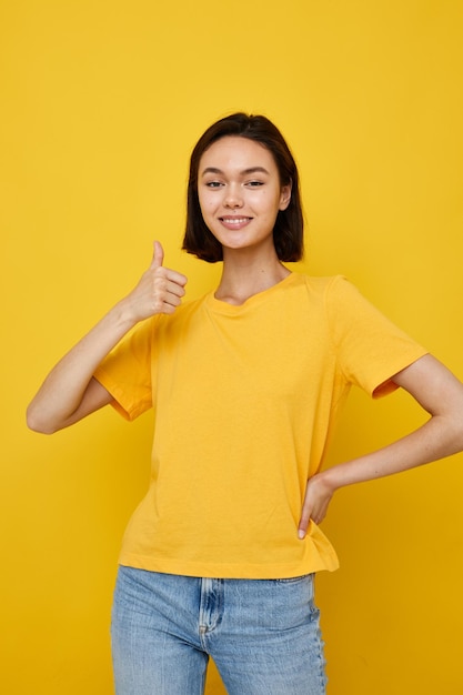 Young beautiful woman in yellow tshirt posing fashion Lifestyle unaltered