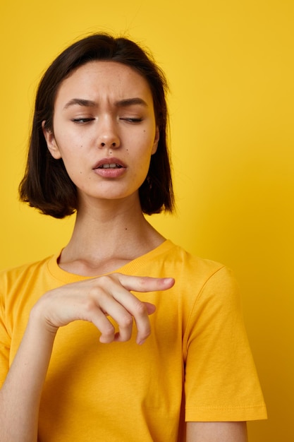 Young beautiful woman in yellow tshirt posing fashion Lifestyle unaltered