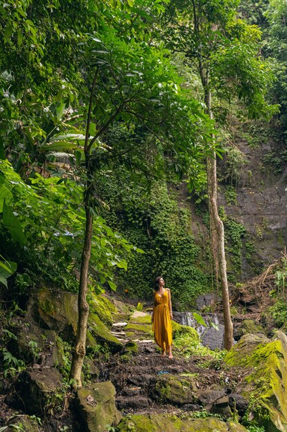 Young beauty. Relaxed young female enjoying the beauty of wild nature while walking and meditating