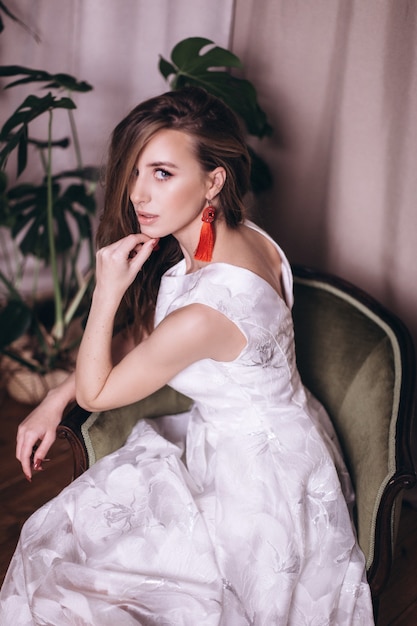 Young beauty woman portrait in white dress. Wedding, ellegance, fashion concept