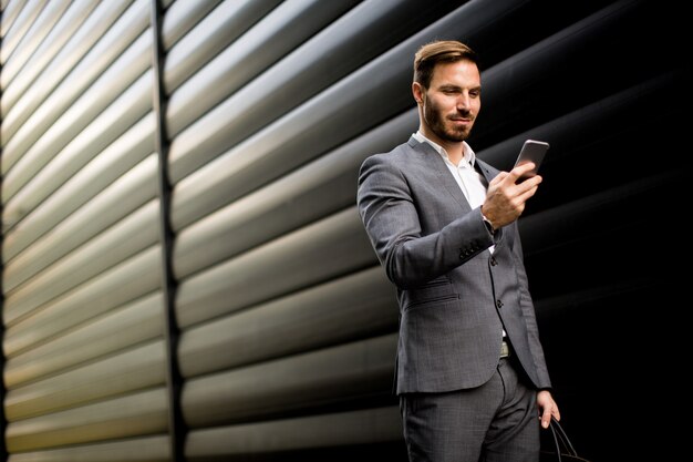 Young bisinessman with mobile phone