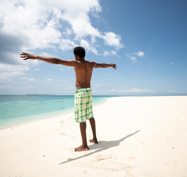 Young black African man on beautiful beach sea coast