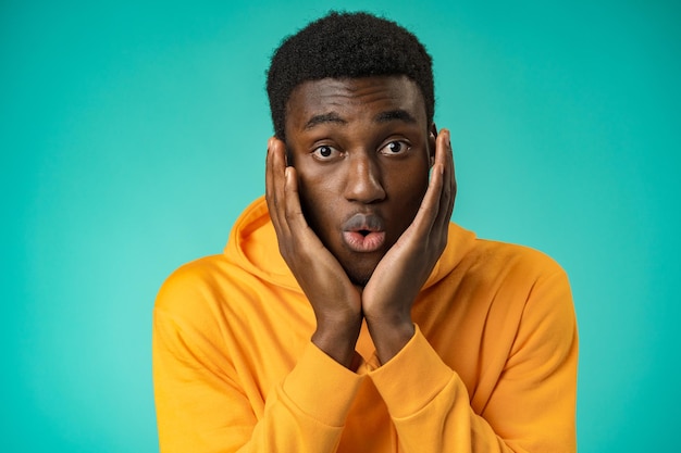 Young black anxious man worried nervous fail problem over mint background