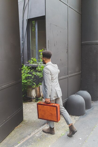 Young black business man walking to work outdoor