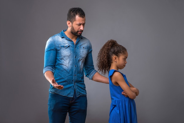 Young black father with his teenage daughter