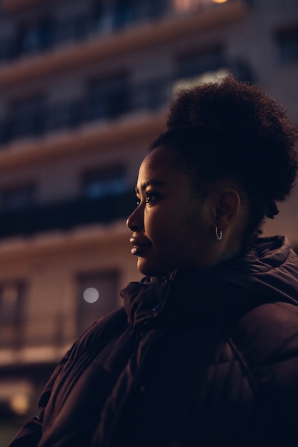 Young black girl posing in the street