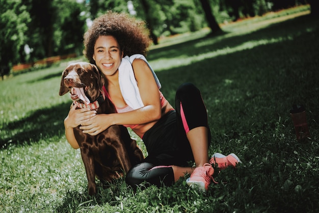 Young Black Girl in Sportswear Relaxing after Jugging