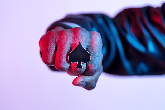 Young Black guy displaying his large ring with spades symbol