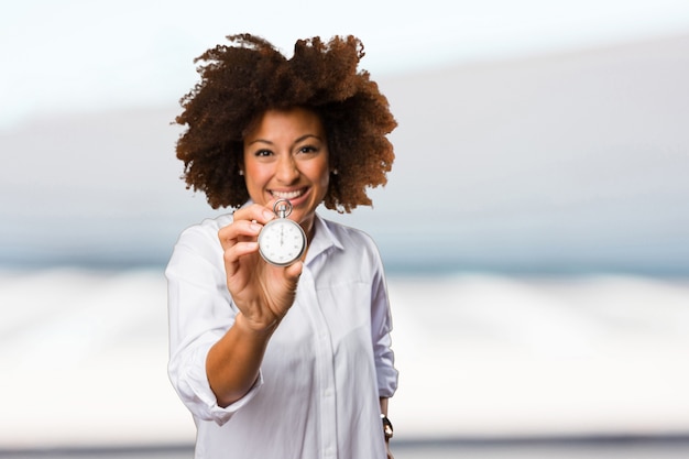 young black woman holding a stopwatch