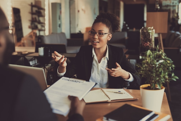 Young Black Woman Interviewing Man In The Office