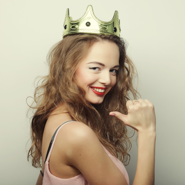 Young blond woman in crown