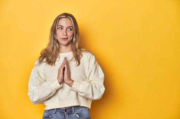 Young blonde caucasian woman expressing emotions isolated