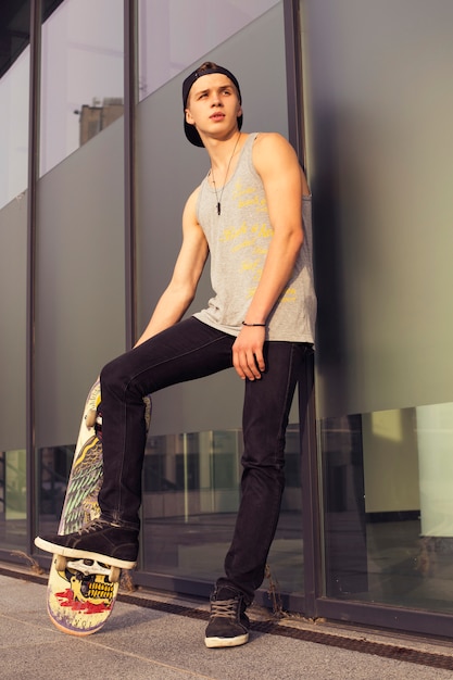 Young blonde guy with a skateboard