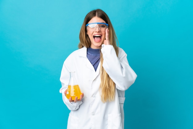 Young blonde scientific woman isolated with surprise and shocked facial expression