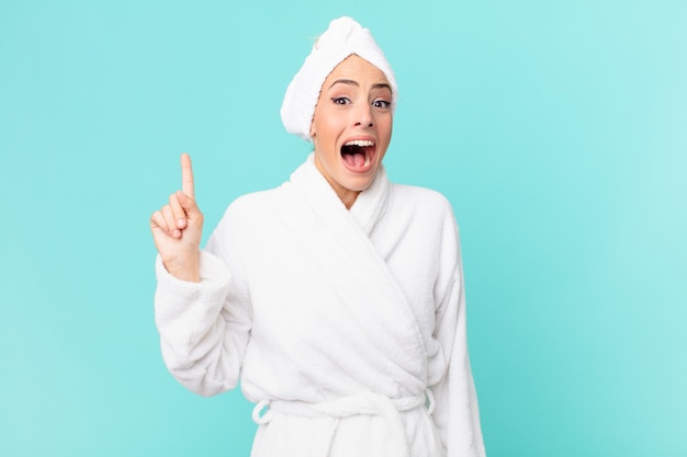 Young blonde woman feeling like a happy and excited genius after realizing an idea. shower concept.