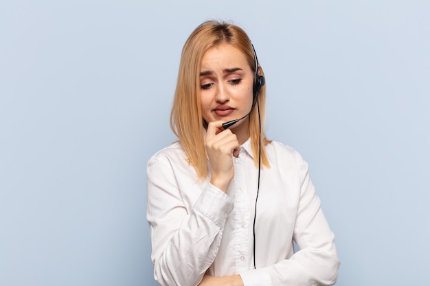 Young blonde woman feeling serious