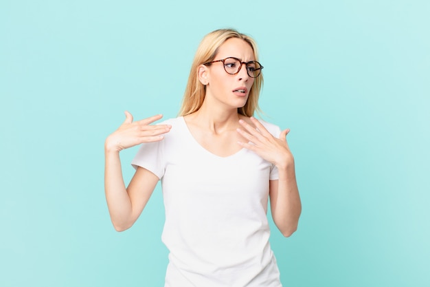 young blonde woman feeling stressed, anxious, tired and frustrated