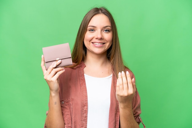 Young blonde woman over isolated background