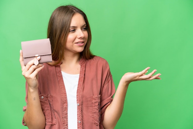 Young blonde woman over isolated background