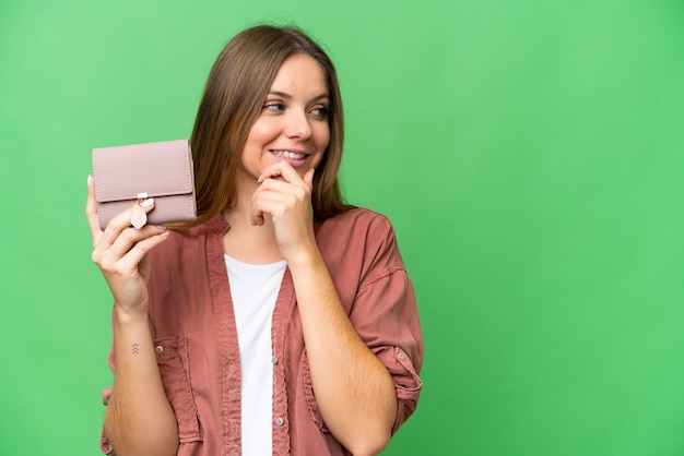 Young blonde woman over isolated background