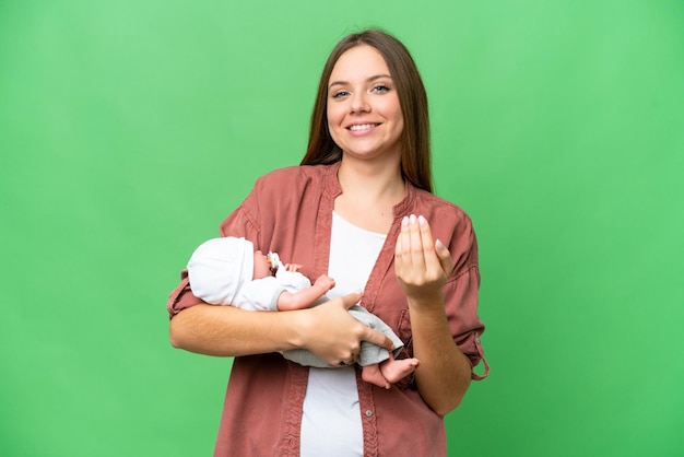 Young blonde woman over isolated background