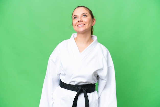 Young blonde woman over isolated background