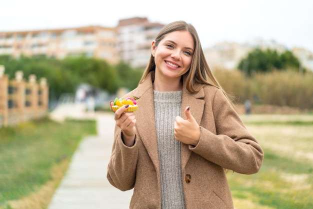 Young blonde woman over isolated background