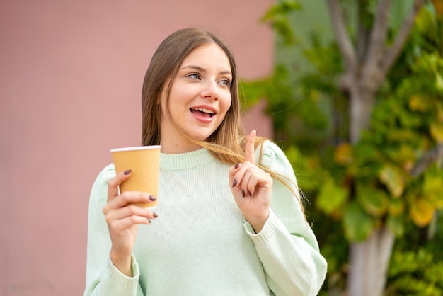 Young blonde woman over isolated background