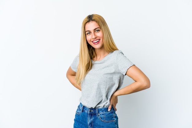 Young blonde woman isolated on white background happy, smiling and cheerful.