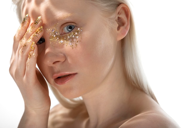 Young blonde woman with shiny make-up portrait