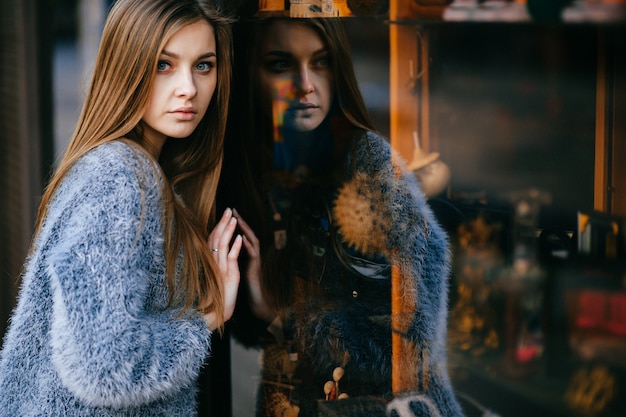 Young blue eyed brunette posing outdoors