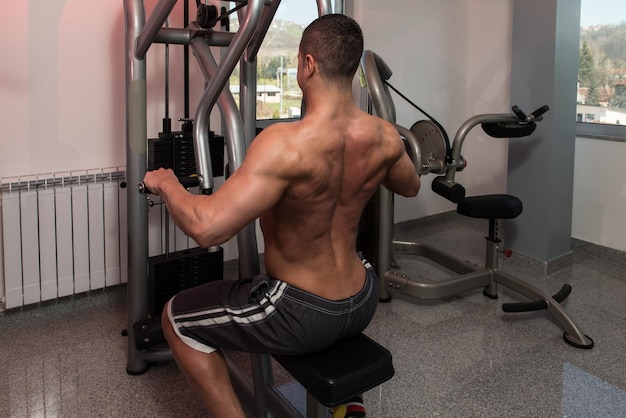 Young Bodybuilder Doing Heavy Weight Exercise For Back