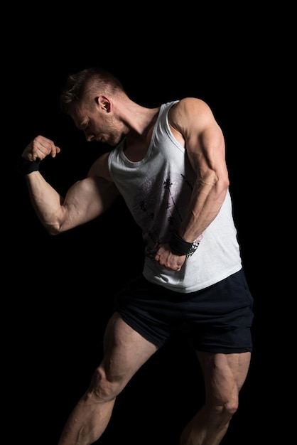 Young Bodybuilder Flexing Muscles  Isolate On Black Blackground  Copy Space