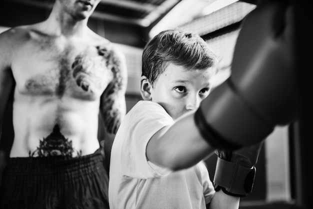 Young boy aspiring to become a boxer