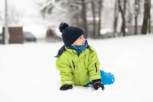 Young Boy Enjoying Himself in the Snow