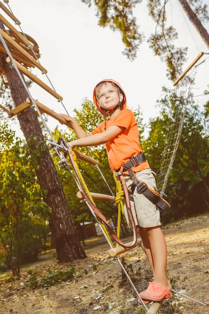 Young boy playing and having fun doing activities outdoors