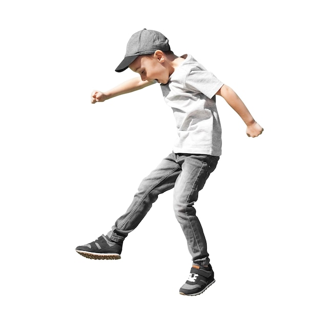 A Young boy runs in the jump on the street on a bright blue background