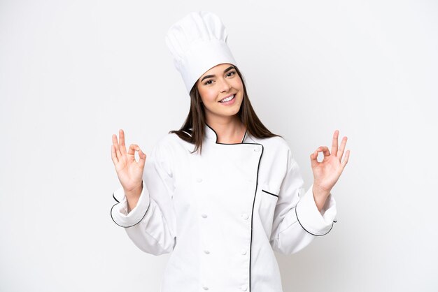 Young Brazilian chef woman isolated on white background in zen pose