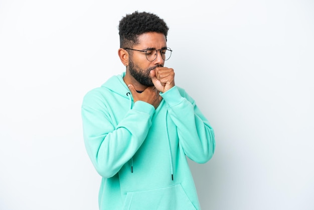 Young Brazilian man isolated on white background coughing a lot