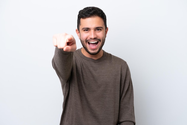 Young Brazilian man isolated on white background frustrated and pointing to the front