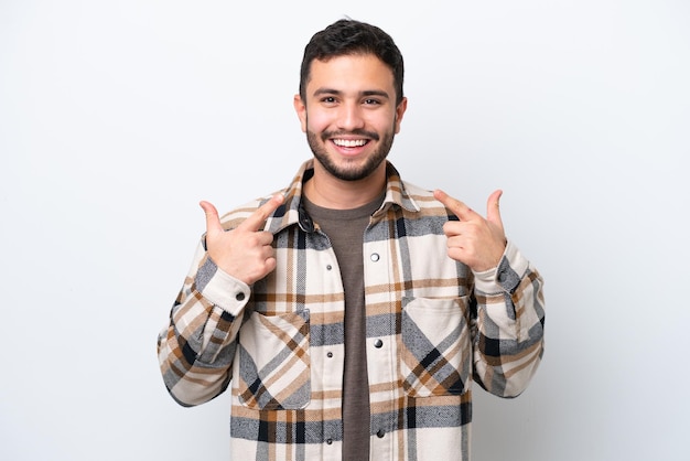 Young Brazilian man isolated on white background giving a thumbs up gesture