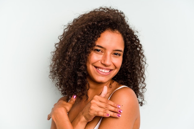 Young Brazilian woman isolated on blue background