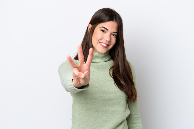 Young Brazilian woman isolated on white background happy and counting three with fingers